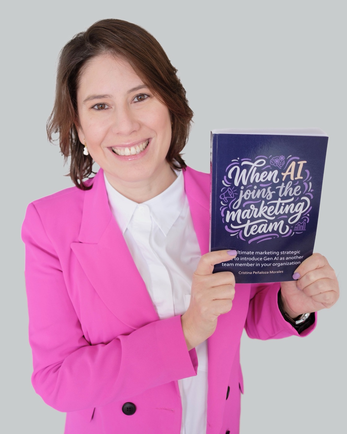 Cristina Peñaloza Morales holding her book When AI Joins The Marketing Team