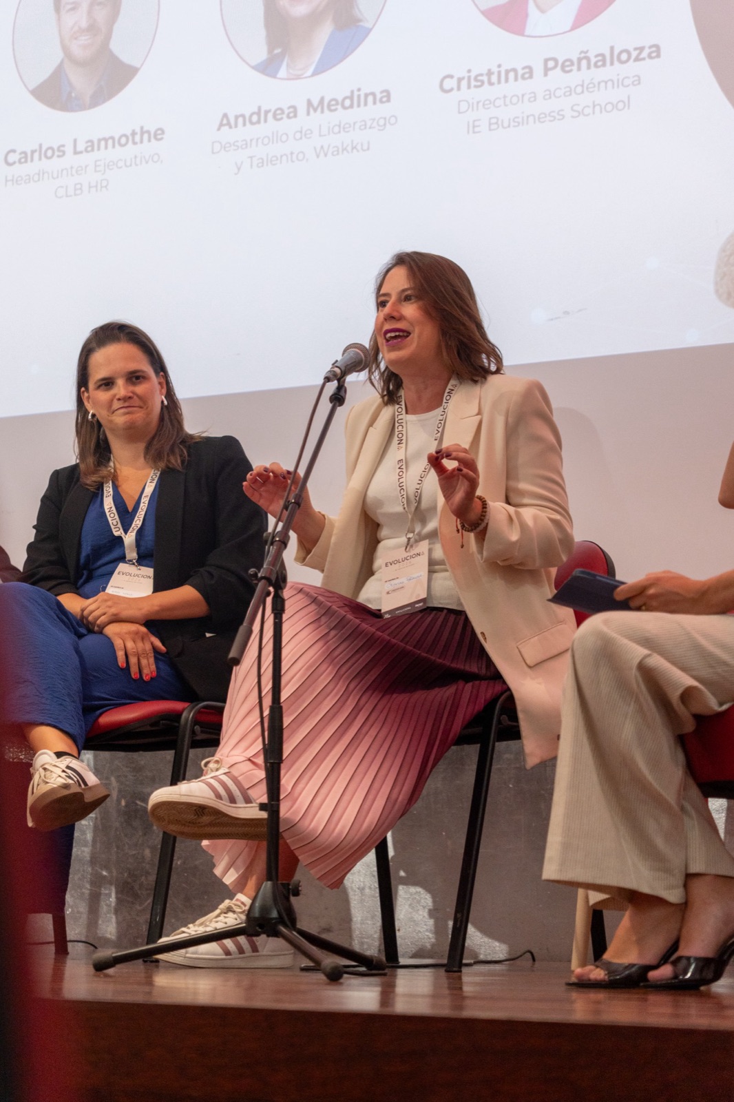 Cristina Peñaloza speaking on a panel at Evoluciona